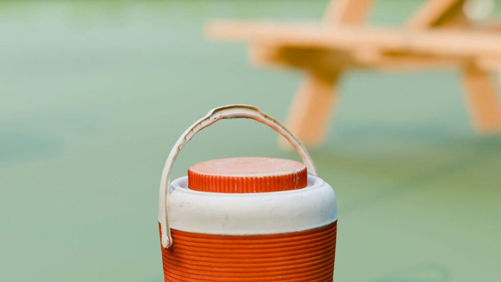 Portable cooler at a campsite for camping and road-trip food storage