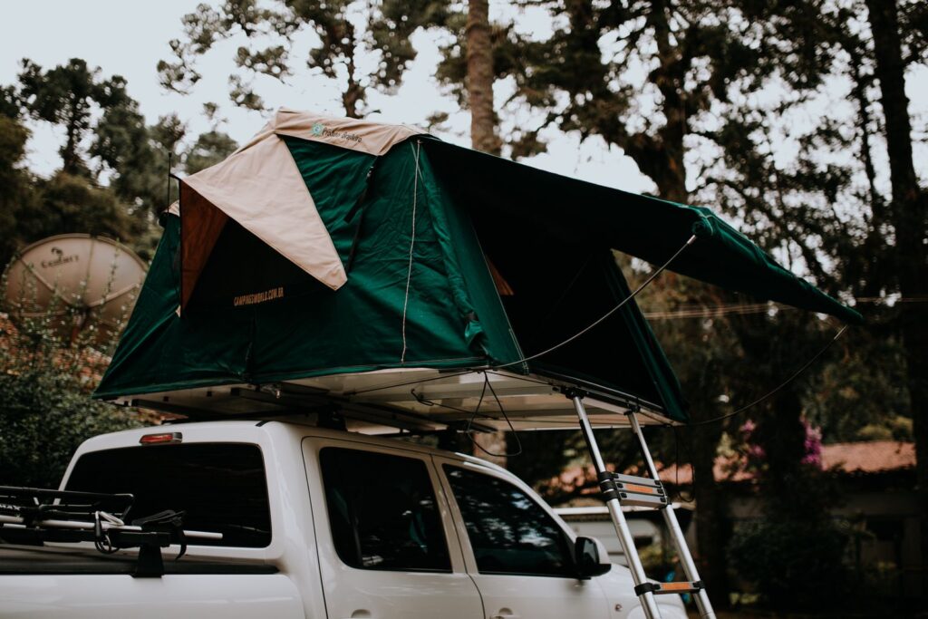 Best Roof Cargo Boxes for Camping Road Trips Vehicle prepared for an outdoor camping road trip