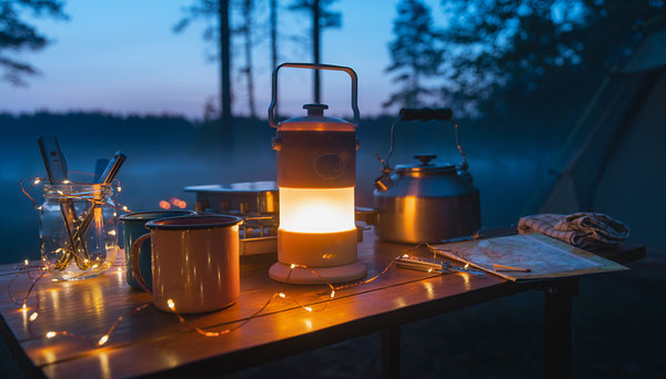 String lights and lantern at campsite