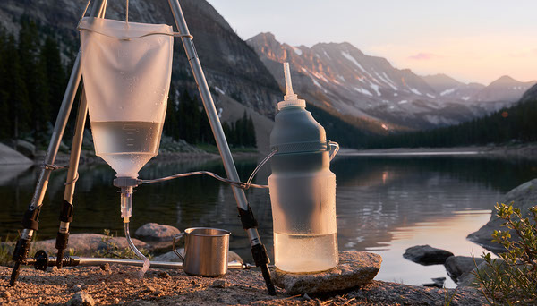 Gravity water filter bag and squeeze filter by lake