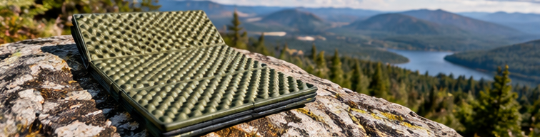 Foldable foam sitting pad on a scenic rock