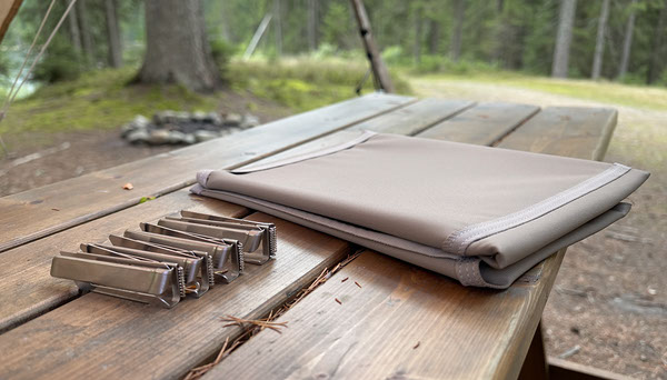Tablecloth Clips vs Elastic Table Cover for Camping Tablecloth Clips vs Elastic Table Cover for Camping editorial illustration
